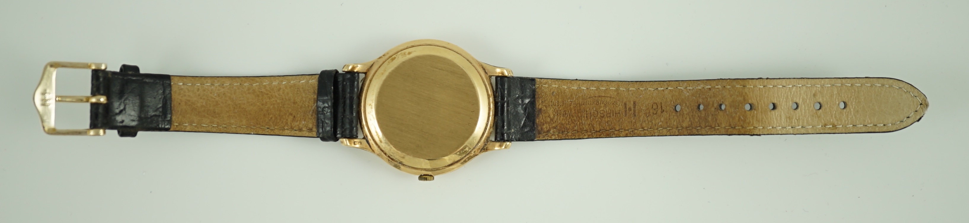 A gentleman's 9ct gold Jaeger LeCoultre manual wind dress wrist watch, on associated strap